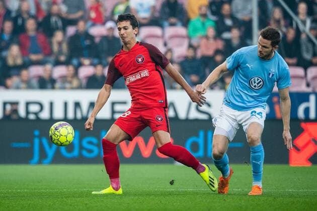 180830 Gustav Wikheim of Midtjylland and Lasse Nielsen of Malmö FF during the Europe League qualifying match between Midtjylland and Malmö FF on August 30, 2018 in Herning Photo Ludvig Thunman BILDBYR N code LT 35529  Copyright: LUDVIGxTHUNMAN BB180830LT028