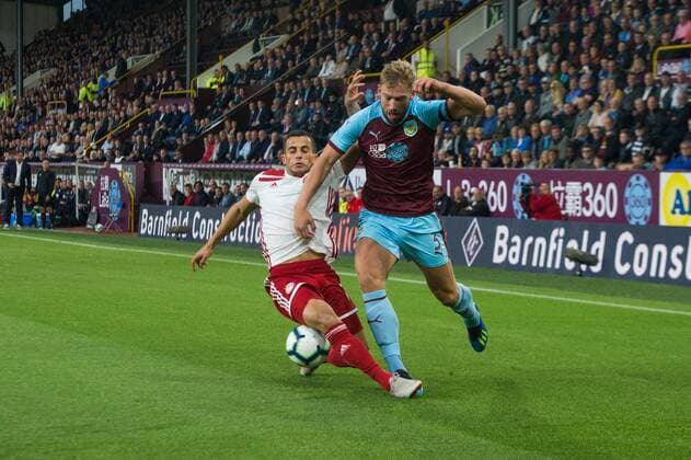 Burnley v Olympiakos F.C. UEFA Europa League Omar Elabdellaoui of Olympiakos tackles Charlie Taylor of Burnley during the UEFA Europa League match at Turf Moor, Burnley Content Not Available For UK Newspapers Copyright: xMattxWilkinsonx FIL-12218-0012