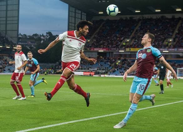 Burnley v Olympiakos F.C. UEFA Europa League Roderick Miranda of Olympiakos heads clear from Ashley Barnes of Burnley during the UEFA Europa League match at Turf Moor, Burnley Content Not Available For UK Newspapers Copyright: xMattxWilkinsonx FIL-12218-0016