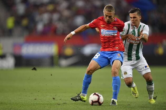 FCSB - SK Rapid Wien FCSB s Mihai Roman in action against SK Rapid Wien s Thomas Murg during UEFA Europa League 2018 2019, Play-Offs, 2st leg match between FCSB and SK Rapid Wien, on National Arena, Bucharest, Romania, 30 August 2018 Copyright: xAlexxNicodimx