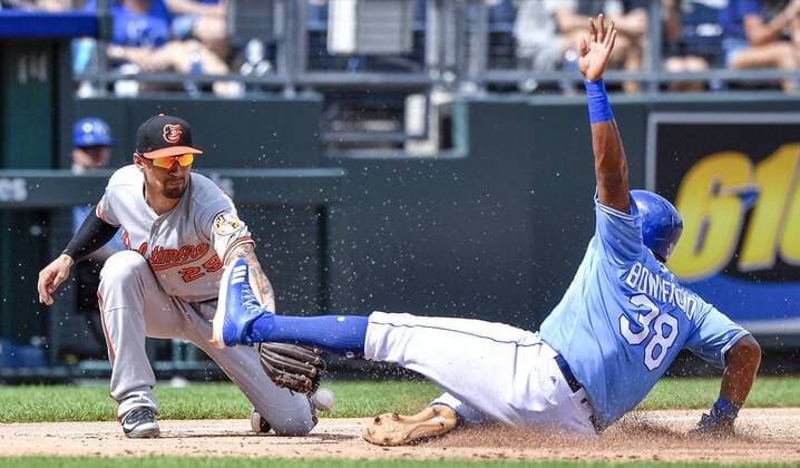September 2, 2018 - Kansas City, MO, USA - Kansas City Royals Jorge Bonifacio slides into third as the ball bounces off the glove of Baltimore Orioles third baseman Jace Peterson, on a two-error pickoff attempt that allowed Bonifacio to score in the third inning on Sunday, Sept. 2, 2018 at Kauffman Stadium in Kansas City, Mo. Baltimore Orioles vs. Kansas City Royals - ZUMAm67_ 20180902_zaf_m67_024 Copyright: xJohnxSleezerx