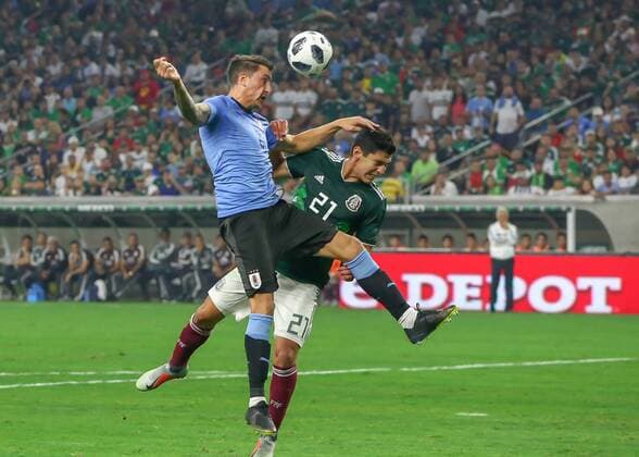 HOUSTON, TX - SEPTEMBER 07: Uruguay defender Jose Maria Gimenez (2) and Mexico defender Jesus Angulo (21) go up for a header during the soccer match between Mexico and Uruguay on September 7, 2018 at NRG Stadium in Houston, Texas. (Photo by Leslie Plaza Johnson Icon Sportswire) SOCCER: SEP 07 Mexico v Uruguay Icon180907001 EDITORIAL USE ONLY