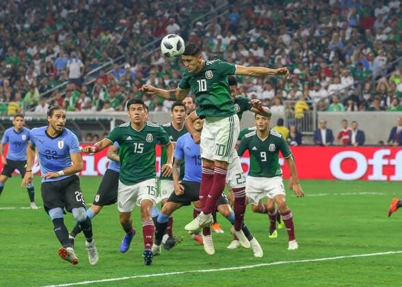 HOUSTON, TX - SEPTEMBER 07: Mexico forward forward Alan Pulido (10) heads the ball away from the goal zone during the soccer match between Mexico and Uruguay on September 7, 2018 at NRG Stadium in Houston, Texas. (Photo by Leslie Plaza Johnson Icon Sportswire) SOCCER: SEP 07 Mexico v Uruguay Icon180907007 EDITORIAL USE ONLY