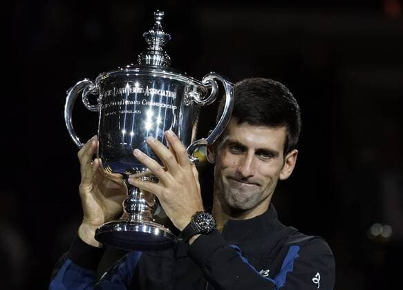Novak Djokovic of Serbia holds up the winner s trophy after he beat Juan Martin Del Potro of Argentina in straight sets in their Men s Singles Final match in Arthur Ashe Stadium at the 2018 US Open Tennis Championships at the USTA Billie Jean King National Tennis Center in New York City on September 9, 2018.  NYP20180910412 RAYxSTUBBLEBINE