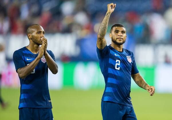 NASHVILLE, TN - SEPTEMBER 11: United States defender DeAndre Yedlin (2) and midfielder Julian Green (16) celebrate as they leave the field after a match between the United States and Mexico on September 11, 2018, at Nissan Stadium in Nashville, TN. (Photo by Bryan Lynn Icon Sportswire) SOCCER: SEP 11 Mexico v USA Icon180911030 EDITORIAL USE ONLY
