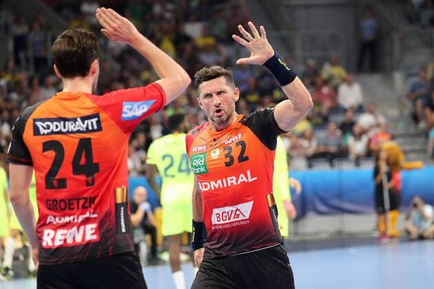 v left Patrick Groetzki RNL 24 Alexander Petersson RNL 32 celebrating a goal Cheers Torjubel Goalkeeping celebrate the goal goal celebration Cheering over the goal optimistic Action Action Handball Champions League Rhein Neckar Löwen Barca Lassa xozx