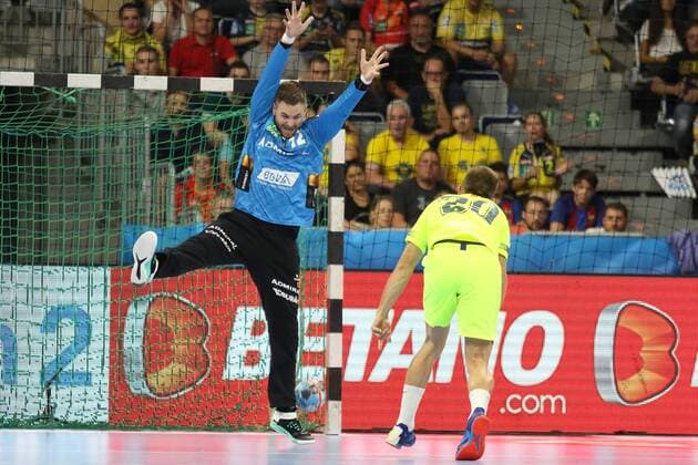 Rhein Neckar Loewen Barca Lassa Rhein Neckar Loewe Andreas Palicka No 12 against Barcelona Alex Gomez No 20 at the Champions League match Rhein Neckar Loewen Barca Lassa Mannheim 12 09 18 Handball Champions League Mannheim Baden Wuerttemberg Germany SAP Arena