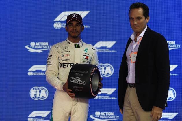 15th September 2018, Marina Bay Street Circuit, Singapore; Formula One Grand Prix of Singapore, Qualification; Mercedes AMG Petronas Motorsport, Lewis Hamilton accepts the Pirelli Pole Position Award from Alberico Avogadro, Pirelli Asia Pacific Sales  ActionPlus12062532 Octane