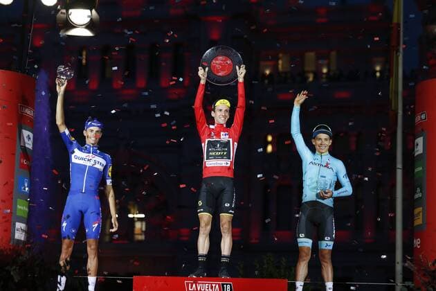 Spanish Enric Mas of Quick-Step Floors, Britain s Simon Yates of Mitchelton - Scott and Spanish Miguel Angel Lopez of Astana Pro Team celebrate on the podium after the 21st and final stage of the Vuelta a Espana , Tour of Spain cycling race, 100,9km from Alcorcon to Madrid, Spain, Sunday 16 September 2018. FRANCE OUT YUZURUxSUNADA  x05427699x