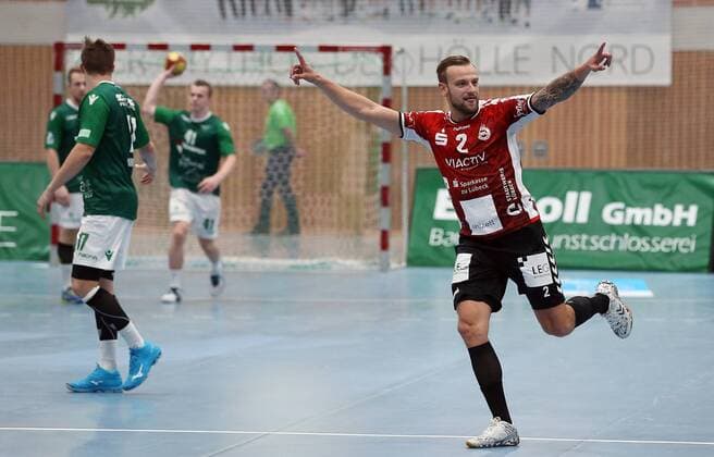Steffen Kaufmann DJK Rimpar Wolves Patrick Schmidt DJK Rimpar Wolves Fin Backs DJK Rimpar Wolves Thees Glabisch VfL Lübeck Schwartau cheers DKB 2 Handball Bundesliga DJK Rimpar Wolves VfL Lübeck Schwartau xfsx