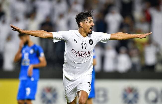 (180918) -- DOHA, Sept. 18, 2018 -- Baghdad Bounedjah of Al Sadd celebrates after scoring the second goal during the AFC Asian Champions League quarterfinal second leg football match between Qatar s Al Sadd and Iran s Esteghlal FC in Doha, capital of Qatar, Sept. 17, 2018. Al Sadd was qualified for the semifinal after a 2-2 draw in the second leg of the quarterfinal with Esteghlal FC gave them a 5-3 aggregate win. ) (SP)QATAR-DOHA-FOOTBALL-AFC-ASIAN CHAMPIONS LEAGUE Nikku 