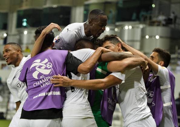 (180918) -- DOHA, Sept. 18, 2018 -- Baghdad Bounedjah (2nd R) of Al Sadd celebrates with teammates after scoring the second goal during the AFC Asian Champions League quarterfinal second leg football match between Qatar s Al Sadd and Iran s Esteghlal FC in Doha, capital of Qatar, Sept. 17, 2018. Al Sadd was qualified for the semifinal after a 2-2 draw in the second leg of the quarterfinal with Esteghlal FC gave them a 5-3 aggregate win. ) (SP)QATAR-DOHA-FOOTBALL-AFC-ASIAN CHAMPIONS LEAGUE Nikku 