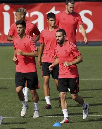 Real Madrid s players Dani Carvajal (R) and midfielder Marco Asensio (L) attend the team s training session at Valdebebas city in Madrid, Spain, 18 September 2018. Real Madrid will be facing Roma in a Champions League match next 19 September 2018. Real Madrid training session !ACHTUNG: NUR REDAKTIONELLE NUTZUNG!  Copyright: xBALLESTEROSx GRAF5255 20180918-636728700212878600