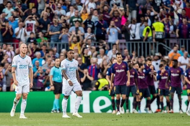 BARCELONA, 18-09-2018, Stadium Nou Camp, season 2018 2019, Champions League football. PSV midfielder Jorrit Hendrix (LL) and PSV forwarder Steven Bergwijn (L) dejected after Barcelona player Lionel Messi (NOT IN PHOTO) scored 1-0 during the game FC Barcelona Barca - PSV. Barcelona - PSV  x2474659x