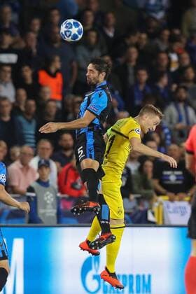 Club s Benoit Poulain and Dortmund s Marco Reus fight for the ball during a game between Belgian soccer team Club Brugge KV and German club Borussia Dortmund, in Brugge, Tuesday 18 September 2018, day one of the UEFA Champions League, in group A. BRUNOxFAHY  x05428651x