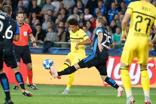 Dortmund s Jadon Sancho and Club s Ruud Vormer fight for the ball during a game between Belgian soccer team Club Brugge KV and German club Borussia Dortmund, in Brugge, Tuesday 18 September 2018, day one of the UEFA Champions League, in group A. KURTxDESPLENTER  x05428687x