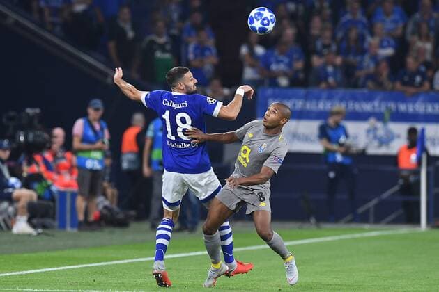 Football Champions League Group Stage 1 Gameday FC Schalke 04 FC Porto on 18 09 2018 in the Veltins Arena in Gelsenkirchen Daniel Caligiuri Schalke left Yacine Brahimi Porto right DFL Regulations prohibit any use of images as image sequences or quasi video xRx