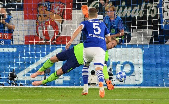 Football UEFA Champions League Mens Season 2018 2019 Group D 1 Gameday VELTINS Arena Gelsenkirchen FC Schalke 04 S04 blue FC Porto gray Ralf Fährmann S04 parried the penalty by Alex Telles FCP action UEFA REGULATIONS PROHIBIT ANY USE OF PHOTOGRAPHS AS IMAGE SEQUENCES AND OR QUASI VIDEO