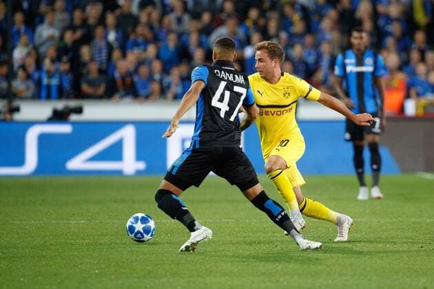 Club s Arnaud Danjuma and Dortmund s Mario Gotze fight for the ball during a game between Belgian soccer team Club Brugge KV and German club Borussia Dortmund, in Brugge, Tuesday 18 September 2018, day one of the UEFA Champions League, in group A. KURTxDESPLENTER  x05428689x