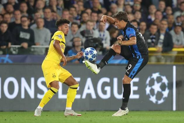 Dortmund s Jadon Sancho and Club s Jelle Vossen fight for the ball during a game between Belgian soccer team Club Brugge KV and German club Borussia Dortmund, in Brugge, Tuesday 18 September 2018, day one of the UEFA Champions League, in group A. BRUNOxFAHY  x05428698x