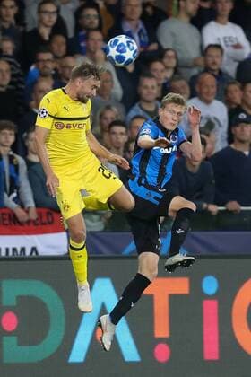 Dortmund s Marcel Schmelzer and Club s Thibault Vlietinck fight for the ball during a game between Belgian soccer team Club Brugge KV and German club Borussia Dortmund, in Brugge, Tuesday 18 September 2018, day one of the UEFA Champions League, in group A. BRUNOxFAHY  x05428699x