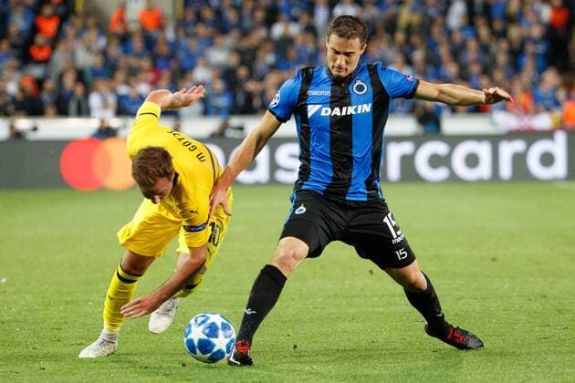 Dortmund s Mario Gotze and Club s Matej Mitrovic fight for the ball during a game between Belgian soccer team Club Brugge KV and German club Borussia Dortmund, in Brugge, Tuesday 18 September 2018, day one of the UEFA Champions League, in group A. KURTxDESPLENTER  x05428705x