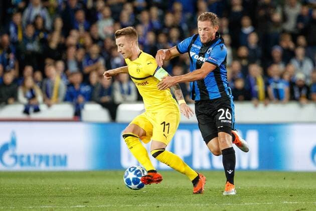 Dortmund s Marco Reus and Club s Mats Rits fight for the ball during a game between Belgian soccer team Club Brugge KV and German club Borussia Dortmund, in Brugge, Tuesday 18 September 2018, day one of the UEFA Champions League, in group A. KURTxDESPLENTER  x05428717x