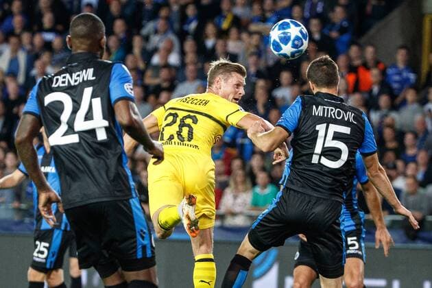 Dortmund s Lukasz Piszczek and Club s Matej Mitrovic fight for the ball during a game between Belgian soccer team Club Brugge KV and German club Borussia Dortmund, in Brugge, Tuesday 18 September 2018, day one of the UEFA Champions League, in group A. KURTxDESPLENTER  x05428722x