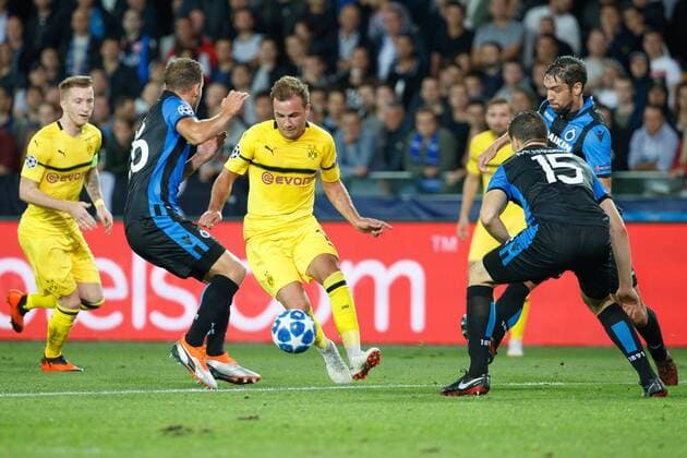 Club s Matej Mitrovic and Dortmund s Marcel Schmelzer fight for the ball during a game between Belgian soccer team Club Brugge KV and German club Borussia Dortmund, in Brugge, Tuesday 18 September 2018, day one of the UEFA Champions League, in group A. KURTxDESPLENTER  x05428720x