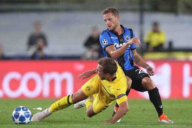 Dortmund s Mario Gotze and Club s Mats Rits fight for the ball during a game between Belgian soccer team Club Brugge KV and German club Borussia Dortmund, in Brugge, Tuesday 18 September 2018, day one of the UEFA Champions League, in group A. BRUNOxFAHY  x05428736x