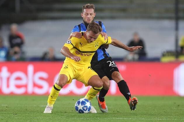 Dortmund s Mario Gotze and Club s Mats Rits fight for the ball during a game between Belgian soccer team Club Brugge KV and German club Borussia Dortmund, in Brugge, Tuesday 18 September 2018, day one of the UEFA Champions League, in group A. BRUNOxFAHY  x05428739x