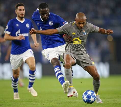 18 09 2018 Football UEFA Champions League 2018 2019 Group Stage 1 Gameday FC Schalke 04 FC Porto in the VELTINS Arena Gelsenkirchen LR Suat Serdar Schalke Salif Sane Schalke in a duel with Yacine Brahimi FC Porto DFL and DFB regulations prohibit any use of images as image sequences and or quasi video
