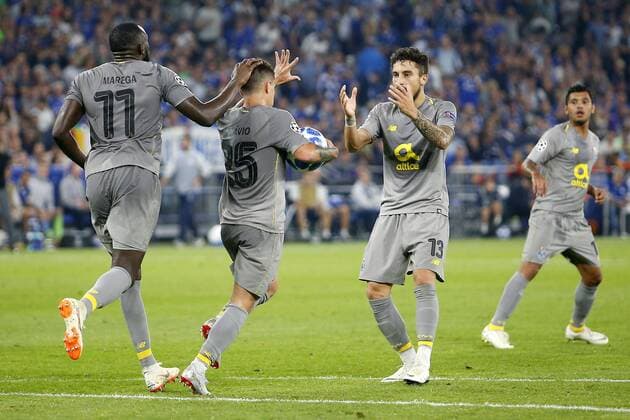 Sport Bilder des Tages GELSENKIRCHEN, 18-09-2018, Veltins Arena, season 2018 2019, Champions League, FC Porto player Moussa Marega(l), FC Porto player Otavio(m) and FC Porto player Alex Telles(r) celebrating the 1-1 during the match Schalke 04 - FC Porto. Schalke - Porto  x2475492x