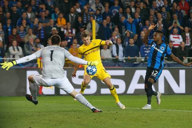 Club s goalkeeper Karlo Letika, Dortmund s Lukasz Piszczek and Club s Emmanuel Bonaventure Dennis fight for the ball during a game between Belgian soccer team Club Brugge KV and German club Borussia Dortmund, in Brugge, Tuesday 18 September 2018, day one of the UEFA Champions League, in group A. BRUNOxFAHY  x05428790x