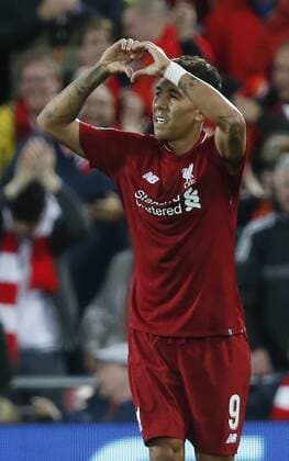 Liverpool forward Roberto Firmino celebrates celebrating scoring the third and winning goal during the UEFA Champions League - Group C match at the Anfield Stadium, Liverpool. Picture date 18th September 2018. Picture credit should read: Andrew Yates Sportimage EDITORIAL USE ONLY. No use with unauthorised audio, video, data, fixture lists, club league logos or live services. Online in-match use limited to 120 images, no video emulation. No use in betting, games or single club league player publications.