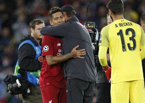 Jurgen Klopp embraces winning goal scorer Liverpool forward Roberto Firmino during the UEFA Champions League - Group C match at the Anfield Stadium, Liverpool. Picture date 18th September 2018. Picture credit should read: Andrew Yates Sportimage EDITORIAL USE ONLY. No use with unauthorised audio, video, data, fixture lists, club league logos or live services. Online in-match use limited to 120 images, no video emulation. No use in betting, games or single club league player publications.