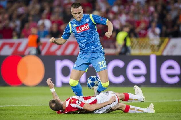 18th September 2018, Rajko Mitic Stadium, Belgrade, Serbia; UEFA Champions League football, Red Star Belgrade versus Napoli; Nenad Krsticic of Red Star Belgrade slide tackles Piotr Zielinski of Napoli  ActionPlus12063687 NikolaxKrstic