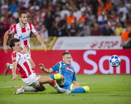 18th September 2018, Rajko Mitic Stadium, Belgrade, Serbia; UEFA Champions League football, Red Star Belgrade versus Napoli; Piotr Zielinski of Napoli in action against Filip Stojkovic and Goran Causic of Red Star Belgrade  ActionPlus12063690 NikolaxKrstic