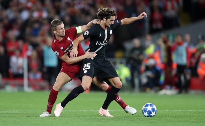 Football - 2018 2019 UEFA Champions League - Group C: Liverpool vs. Paris Saint-Germain Jordan Henderson of Liverpool and Adrien Rabiot of PSG at Anfield. COLORSPORT LYNNE CAMERON 