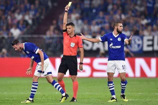 Football Champions League Group Stage 1 Gameday FC Schalke 04 FC Porto on 18 09 2018 in the Veltins Arena in Gelsenkirchen Mark Uth Schalke left Referee Jesus Gil Manzano ESP middle Nabil Bentaleb Schalke right DFL Regulations prohibit any use of images as or sequences xTTx