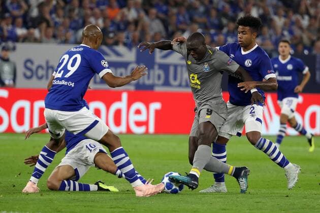 (180919) -- GELSENKIRCHEN, Sept. 19, 2018 -- Aboubakar (3rd L) of Porto fights for the ball during the UEFA Champions League football match between Schalke 04 and FC Porto at the Veltins Arena on Sept. 18, 2018 in Gelsenkirchen, Germany. The match ended 1-1. ) (SP)GERMANY-GELSENKIRCHEN-FOOTBALL-UEFA CHAMPIONS LEAGUE JoachimxBywaletz 