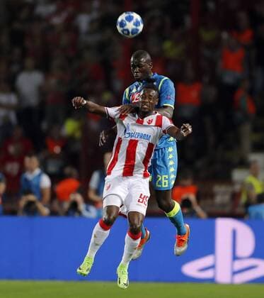 (180919) -- BELGRADE, Sept. 19, 2018 -- Crvena Zvezda s Richmond Boakye (front) competes with Napoli s Kalidou Koulibaly during a UEFA Champions League group C match between Crvena Zvezda and Napoli in Belgrade, Serbia, on Sept. 18, 2018. The match ended 0-0. ) (SP)SERBIA-BELGRADE-UEFA CHAMPIONS LEAGUE-CRVENA ZVEZDA-NAPOLI PredragxMilosavljevic 