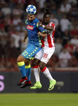 (180919) -- BELGRADE, Sept. 19, 2018 -- Crvena Zvezda s Richmond Boakye (R) competes with Napoli s Raul Albiol during a UEFA Champions League group C match between Crvena Zvezda and Napoli in Belgrade, Serbia, on Sept. 18, 2018. The match ended 0-0. ) (SP)SERBIA-BELGRADE-UEFA CHAMPIONS LEAGUE-CRVENA ZVEZDA-NAPOLI PredragxMilosavljevic 