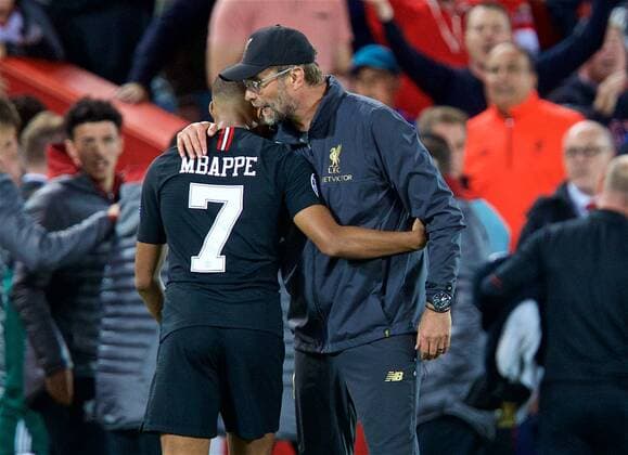 (180919) -- LIVERPOOL, Sept. 19, 2018 -- Liverpool s manager Jurgen Klopp (R) embraces Paris Saint-Germain s Kylian Mbappe after the UEFA Champions League Group C match between Liverpool and Paris Saint-Germain at Anfield Stadium in Liverpool, Britain on Sept. 18, 2018. Liverpool won 3-2. FOR EDITORIAL USE ONLY. NOT FOR SALE FOR MARKETING OR ADVERTISING CAMPAIGNS. NO USE WITH UNAUTHORIZED AUDIO, VIDEO, DATA, FIXTURE LISTS, CLUB LEAGUE LOGOS OR LIVE SERVICES. ONLINE IN-MATCH USE LIMITED TO 45 IMAGES, NO VIDEO EMULATION. NO USE IN BETTING, GAMES OR SINGLE CLUB LEAGUE PLAYER PUBLICATIONS. (SP)BRITAIN-LIVERPOOL-FOOTBALL-UEFA CHAMPIONS LEAGUE-LIVERPOOL VS PSG HanxYan