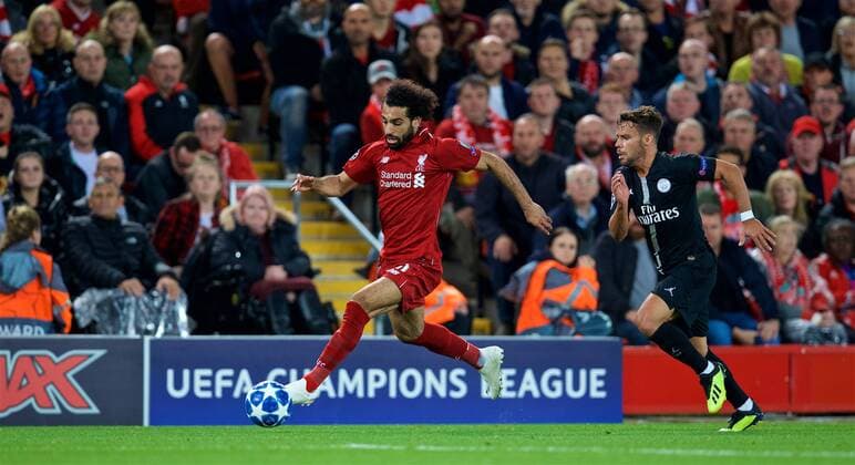 (180919) -- LIVERPOOL, Sept. 19, 2018 -- Liverpool s Mohamed Salah (L) vies with Paris Saint-Germain s Juan Bernat during the UEFA Champions League Group C match between Liverpool and Paris Saint-Germain at Anfield Stadium in Liverpool, Britain on Sept. 18, 2018. Liverpool won 3-2. FOR EDITORIAL USE ONLY. NOT FOR SALE FOR MARKETING OR ADVERTISING CAMPAIGNS. NO USE WITH UNAUTHORIZED AUDIO, VIDEO, DATA, FIXTURE LISTS, CLUB LEAGUE LOGOS OR LIVE SERVICES. ONLINE IN-MATCH USE LIMITED TO 45 IMAGES, NO VIDEO EMULATION. NO USE IN BETTING, GAMES OR SINGLE CLUB LEAGUE PLAYER PUBLICATIONS. (SP)BRITAIN-LIVERPOOL-FOOTBALL-UEFA CHAMPIONS LEAGUE-LIVERPOOL VS PSG HanxYan