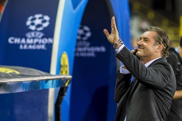 Football Champions League Season 2018 2019 Group Stage 1 Gameday Club Bruges Borussia Dortmund on 18 09 2018 at the Jan Breydel Stadium in Bruges Belgium Dortmund sporting director Michael Zorc greets the fans in the stands while he is on the phone DFL REGULATIONS PROHIBIT ANY USE OF PHOTOGRAPH AS IMAGE SEQUENCES AND OR QUASI VIDEO Copyright: xKirchner DavidxInderliedx