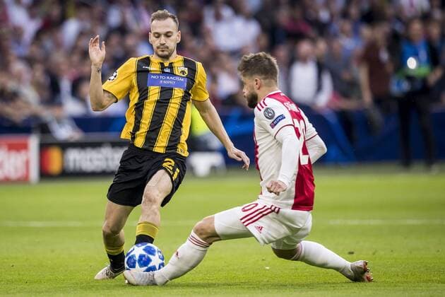 AMSTERDAM, AFC Ajax - AEK Athens FC, football, Champions League, season 2018-2019, 19-09-2018, Stadium Johan Cruijff Arena, AEK Athens player Michalis Bakakis (L), Ajax player Lasse Schone (R) Ajax - AEK Athens  x2476579x