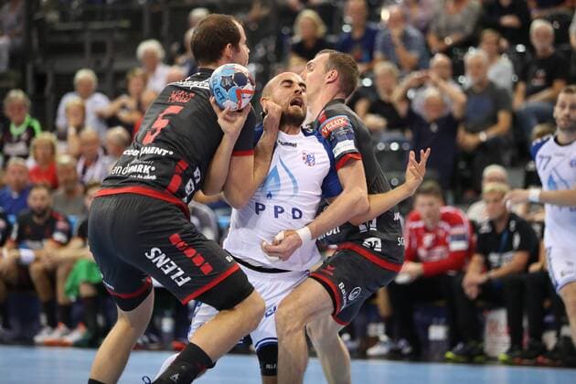 SG Flensburg Handewitt vs HC PPD Zagreb Handball EHF Champions League group stage 19 09 18 Arber Qerimi HC PPD Zagreb 34 against Simon Hald Jensen SG Flensburg Handewitt 05 and Holger Glandorf SG Flensburg Handewitt 09 xmmkx