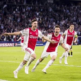 AMSTERDAM, AFC Ajax - AEK Athens FC, football, Champions League, season 2018-2019, 19-09-2018, Stadium Johan Cruijff Arena, Ajax player Nico Tagliafico (L) hass cored 1-0, Ajax player Klaas Jan Huntelaar (M), Ajax player Dusan Tadic (R) Ajax - AEK Athens  x2476730x