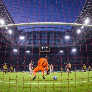 AMSTERDAM, AFC Ajax - AEK Athens FC, football, Champions League, season 2018-2019, 19-09-2018, Stadium Johan Cruijff Arena, Ajax player Nico Tagliafico (3L) scores 1-0, AEK Athens goalkeeper Vassilis Barkas (M) Ajax - AEK Athens  x2476922x